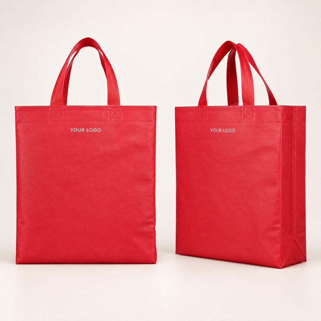 Two red BOPP-laminated non-woven tote bags, shown front and side on