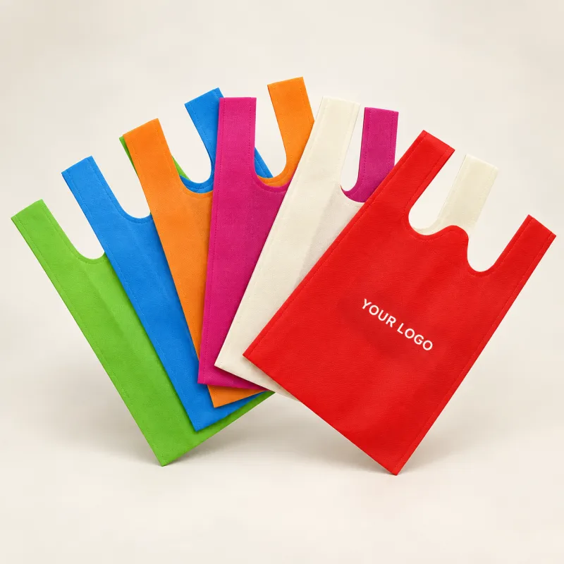 W-cut non-woven vest bags in assorted colours with a printed logo